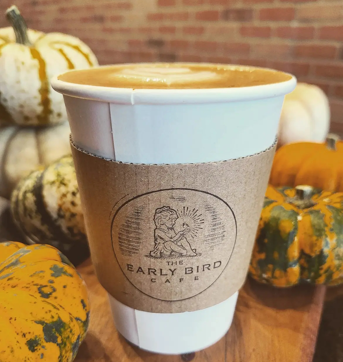 Coffee with pumpkins on the background