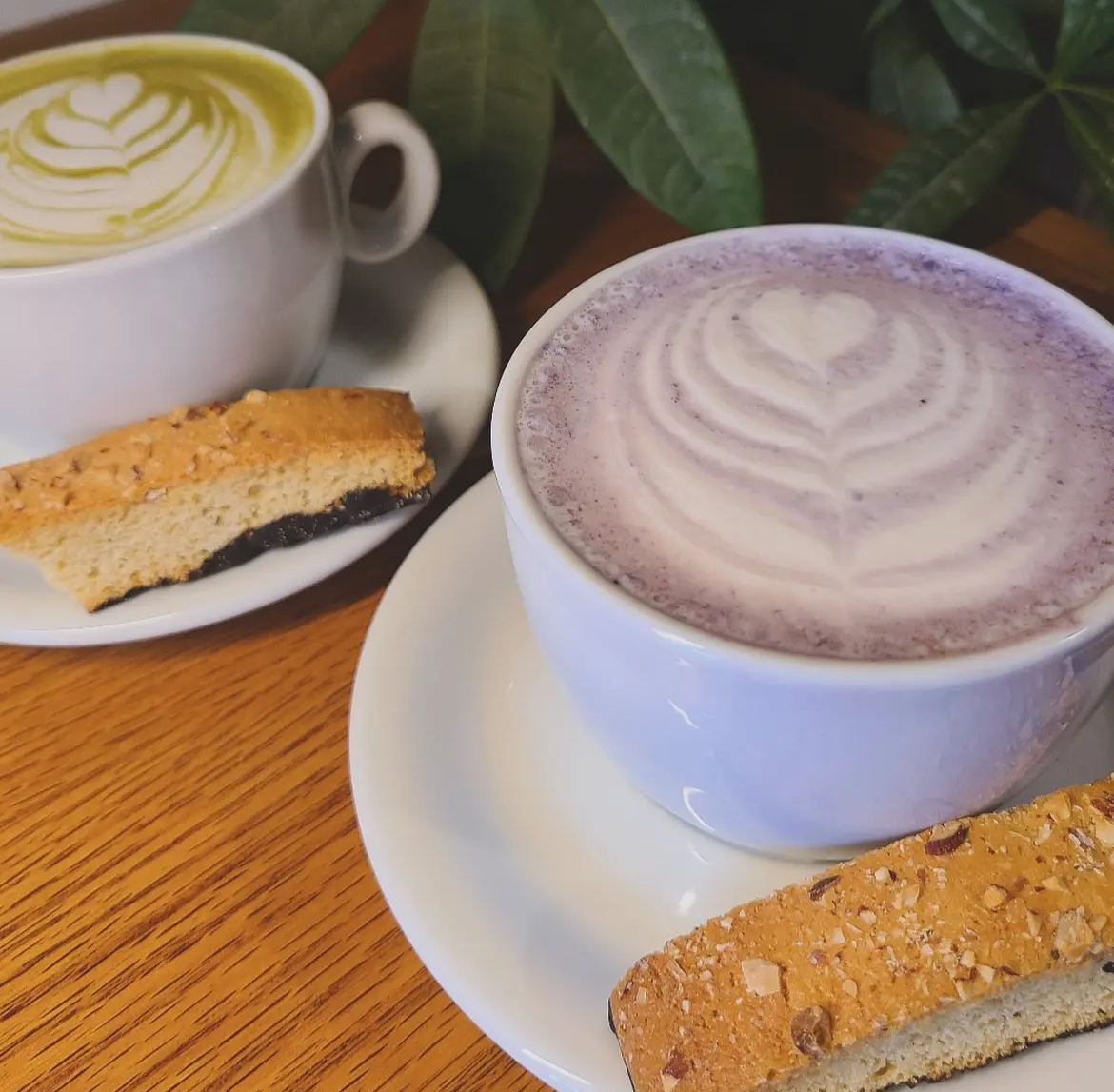 Two coffees with a pastry